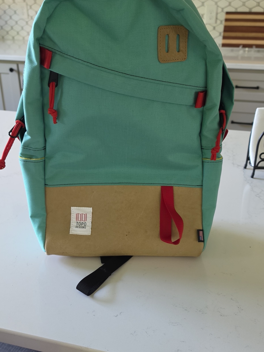 Topo Designs Turquoise and Tan Backpack.